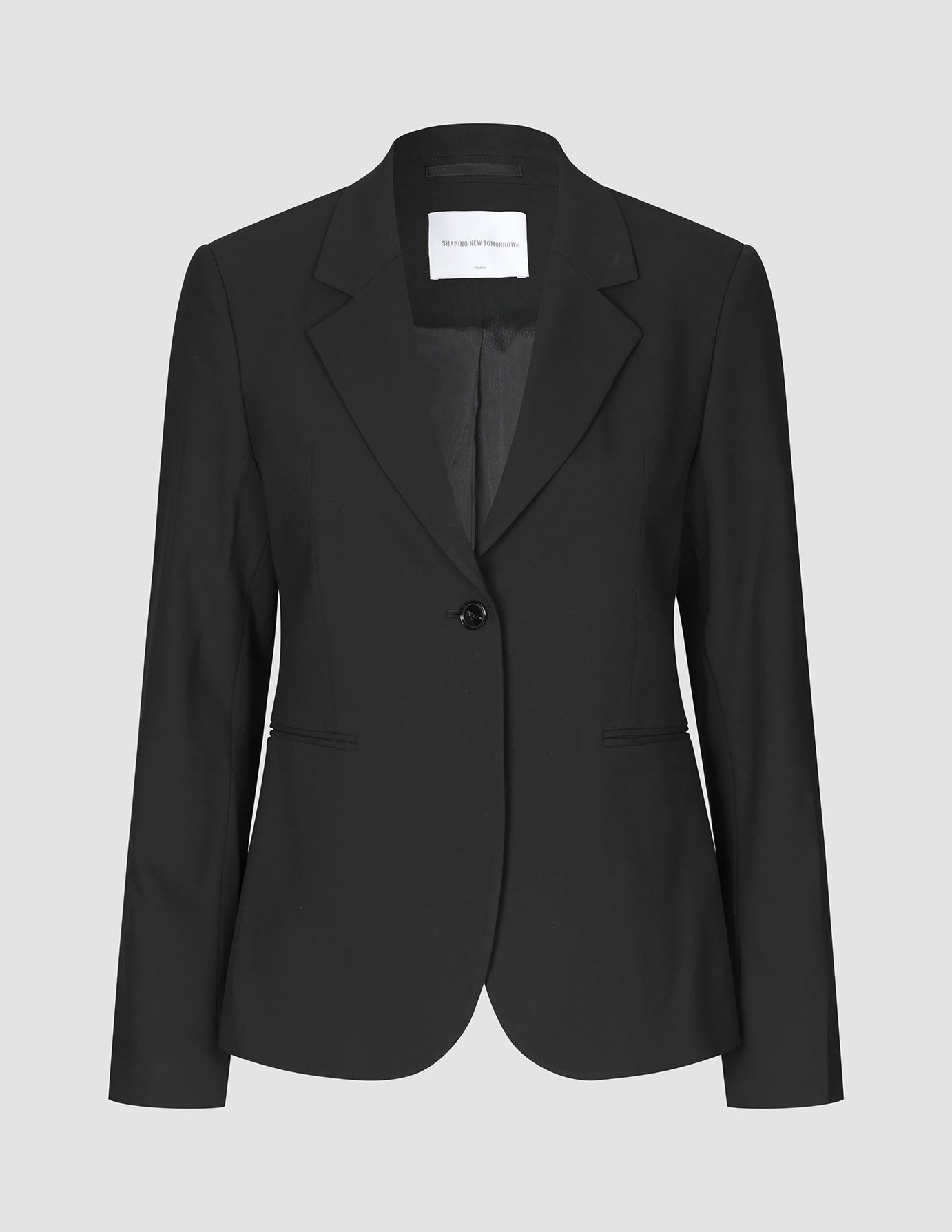 A fitted, single-breasted Ease Suit Wide Black blazer by Shaping New Tomorrow.